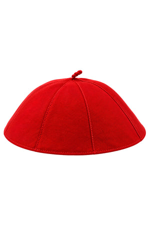 Red clergy zucchetto cap on a white background, featuring eight stitched fabric panels, a rounded shape, and a matching fabric loop at the crown.