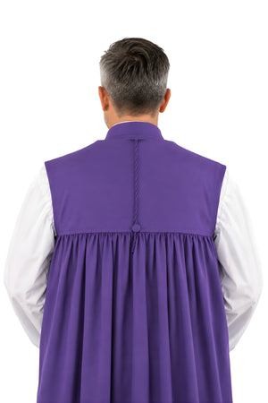 Back view of the Roman purple bishop chimere showing the gathered back, braid detail, center button, and white rochet sleeves underneath.