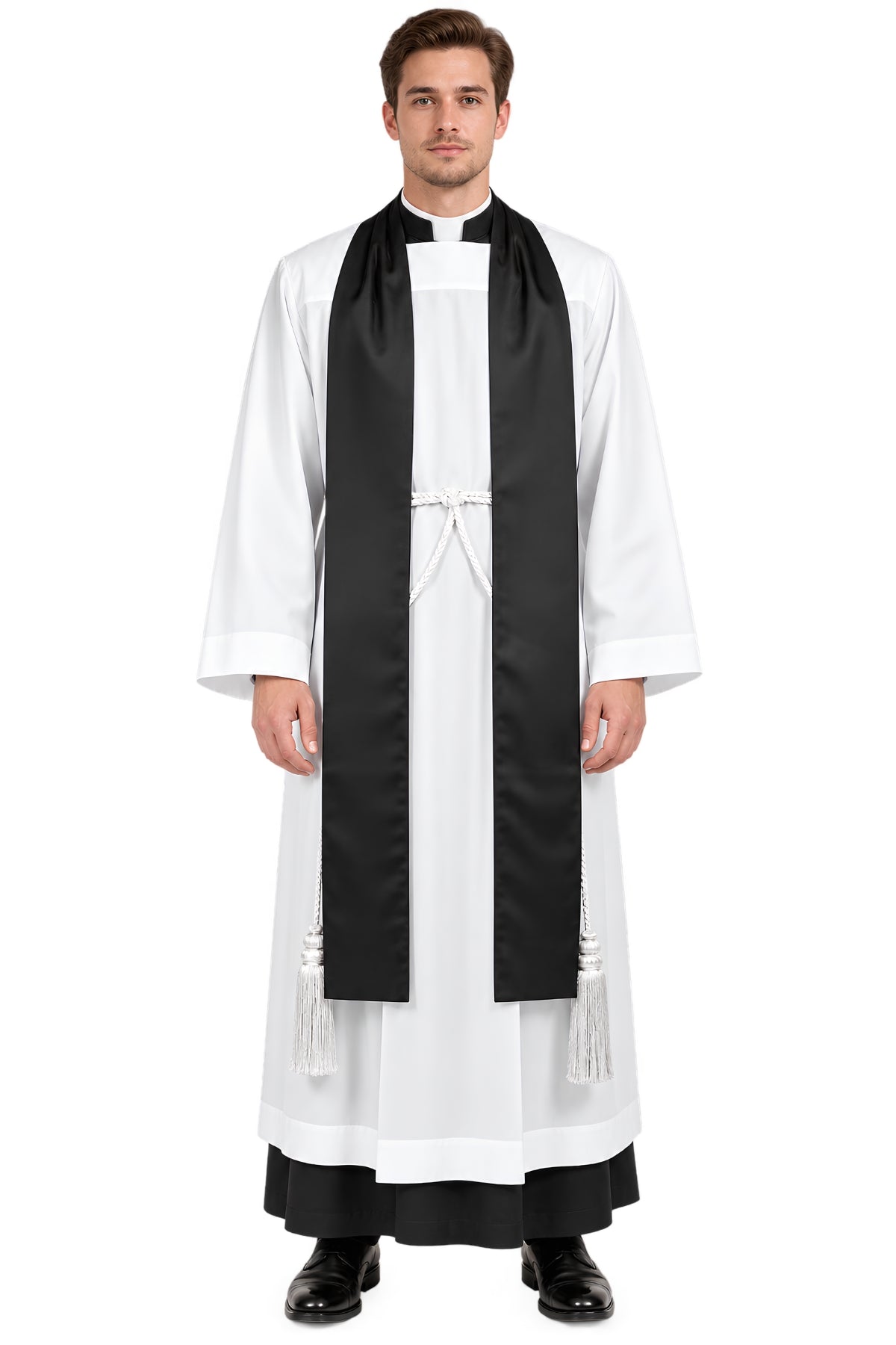 Front view of a clergyman wearing the Faithful Witness black clergy tippet over a white surplice, featuring a long flat black tippet with white braided waist cord and tassels.